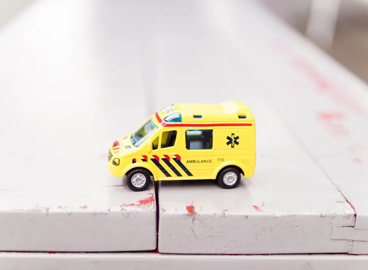 toy ambulance wooden surface 